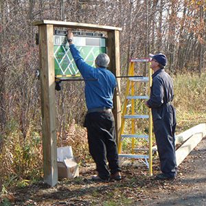 Volunteers erecting new signs